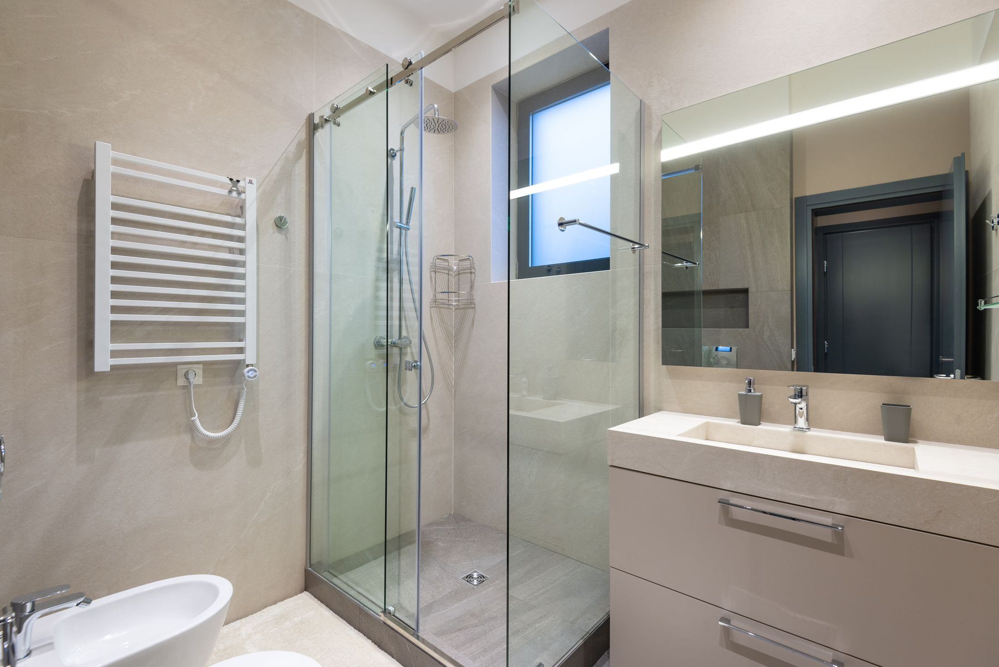 Primary bath remodel in a Ballantyne two-story home with an extended curbless shower