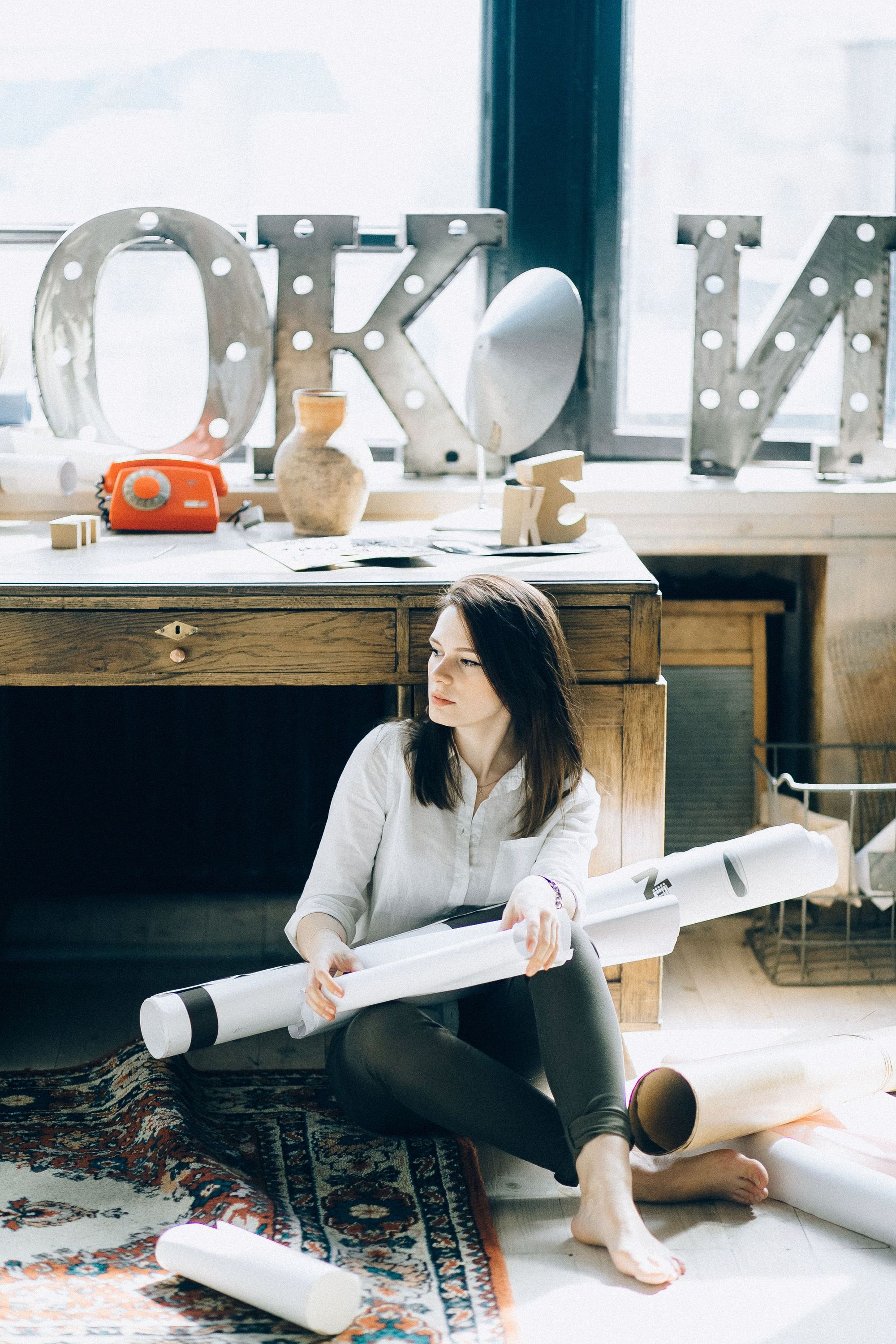 Designer meeting with homeowners at a kitchen table